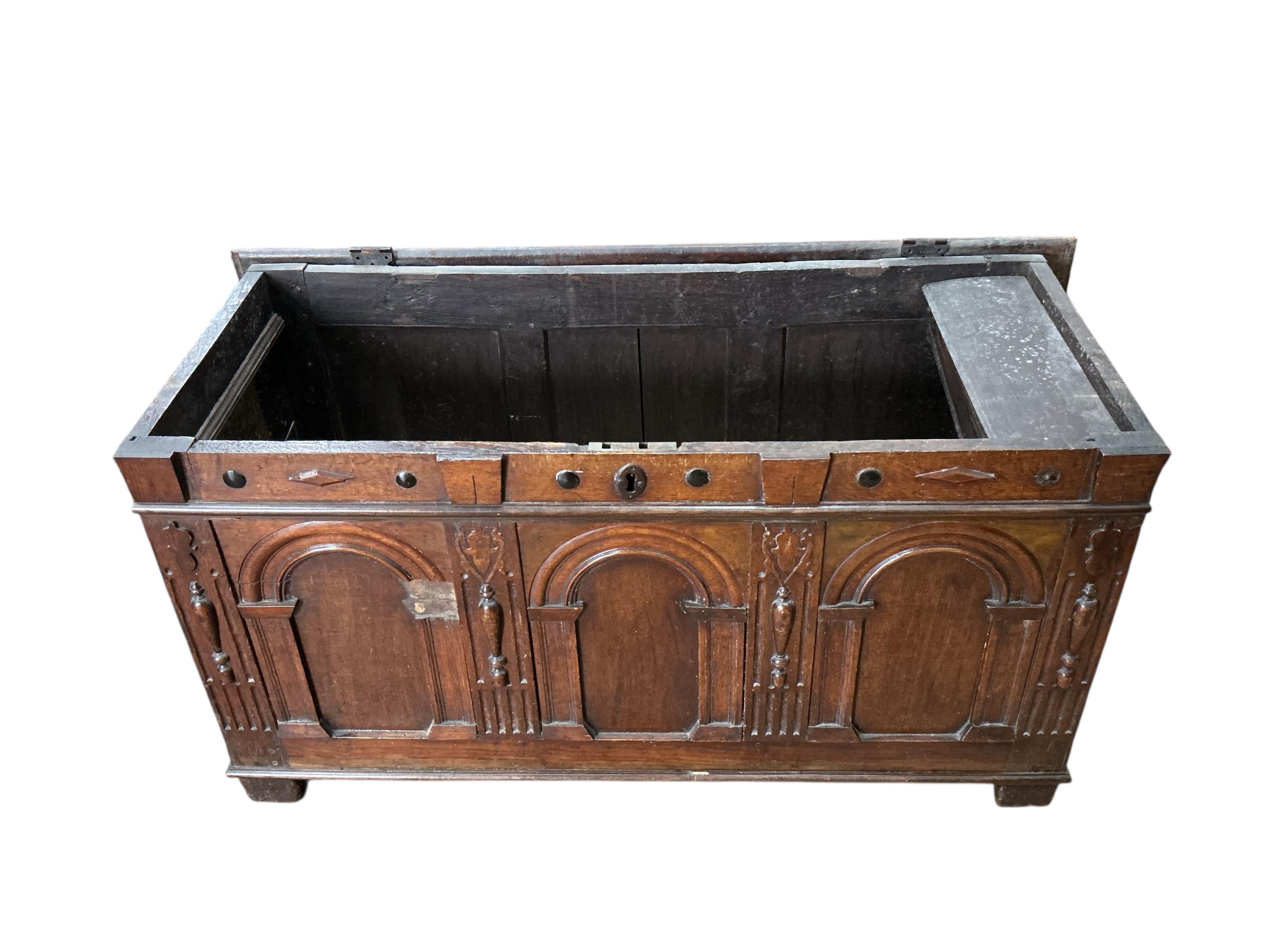 An 18th century oak coffer, width 129cm, depth 53cm, height 66cm